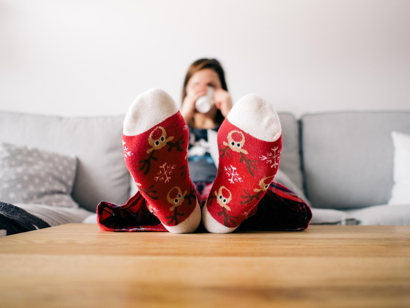 woman with cat on couch home